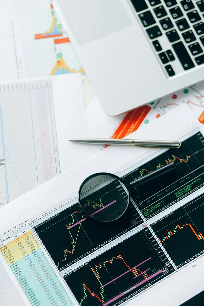 Multiple sheets of paper with charts.