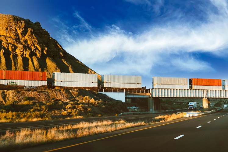 Train and truck representing transportation and logistics operations